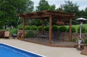 Custom designed pergola by Artisan Construction, 7321 N Antioch Gladstone, MO  64119. Add interest to your outdoor space with a custom designed pergola.