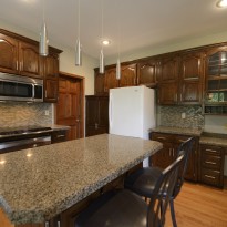 Remodeled kitchen cabinets are painted for updated look by Artisan Construction, 7321 N Antioch Gladstone, MO 64119