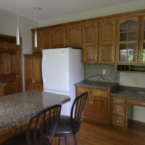 Kitchen cabinets before being painted by Artisan Construction, 7321 N Antioch Gladstone, MO 64119