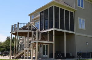 Screened in porch and wrought iron deck by Artisan Construction, 7321 N Antioch Gladstone, MO  64119