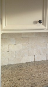 Choose a tile backsplash for your kitchen in stone or tumbled stone. The look of your backsplach will be elegant and statement worthy. This backsplash was installed by Artisan Construction, Gladstone, MO